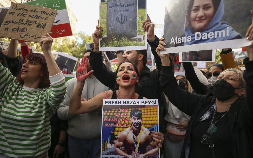 Iranian women shout slogans to protest over the death of Mahsa Amini during a demonstration outside the Iranian consulate in Istanbul, Turkey, Monday, Oct. 17, 2022. Amini, a 22-year-old woman who had been detained by Iran's morality police in the capital of Tehran for allegedly not adhering to Iran's strict Islamic dress code, died while being in police custody.